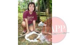 Jingyi Zhang showing the range of material recovered from the pit